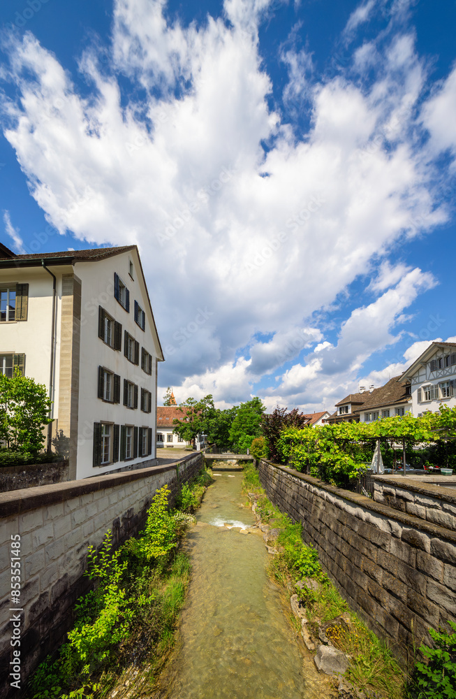 Kusenbach stream between the houses of the town of Kusnacht, Switzerland Kusenbach stream between the houses of the town of Kusnacht, Switzerland