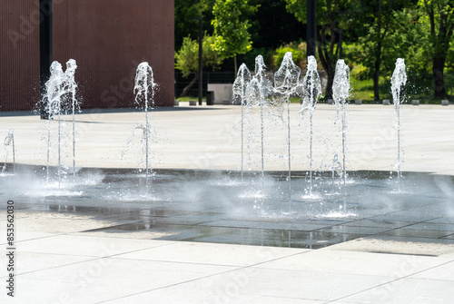 Fototapeta Naklejka Na Ścianę i Meble -  Fountain Water, Falling Fountain Jets, Waterfall Splashes, Waterfalls Motion, Summer Park Stream