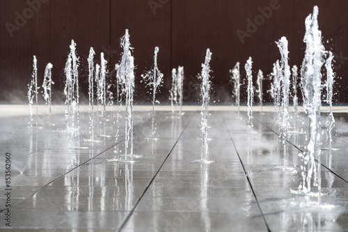 Fototapeta Naklejka Na Ścianę i Meble -  Fountain Water, Falling Fountain Jets, Waterfall Splashes, Waterfalls Motion, Summer Park Stream