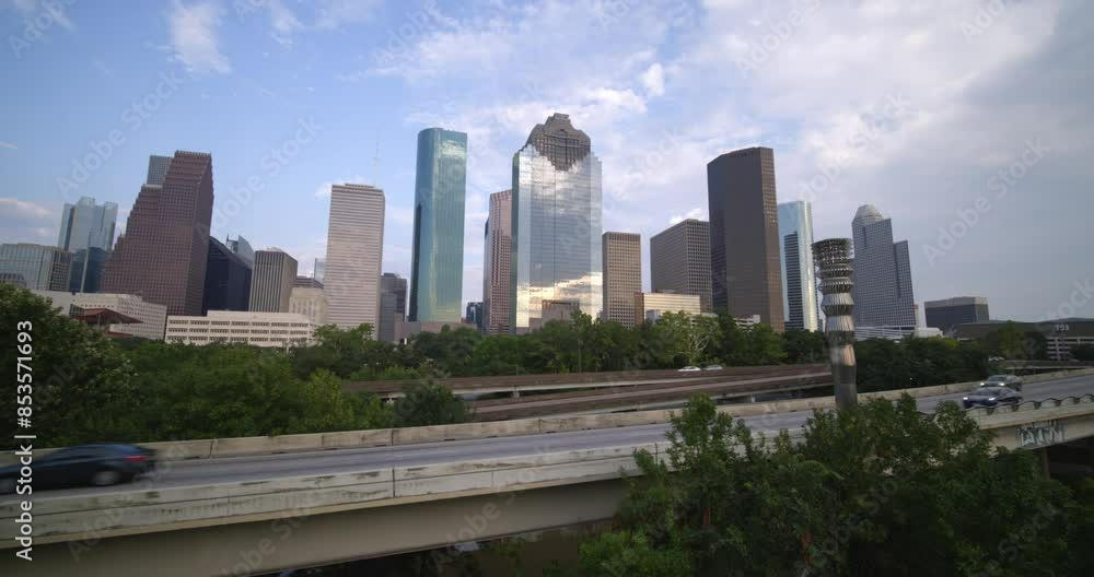 Establishing shot of downtown Houston as cars pass by on I-45 frreeway Establishing shot of downtown Houston as cars pass by on I-45 frreeway