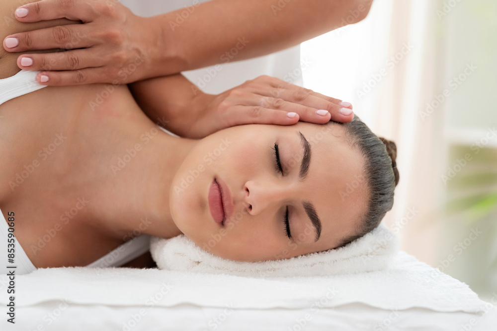 Hands of osteopath treating patient for neck pain at rehabilitation center Hands of osteopath treating patient for neck pain at rehabilitation center
