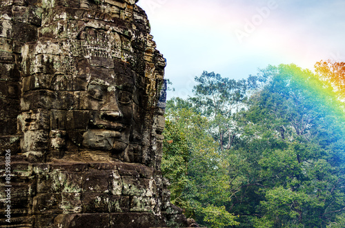 The bayon temple smiling stone faces showing on a sunny day in angkor thom, siem reap, cambodia photo