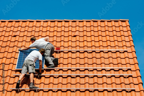 Wallpaper Mural Engineers installing solar panel on house roof Torontodigital.ca