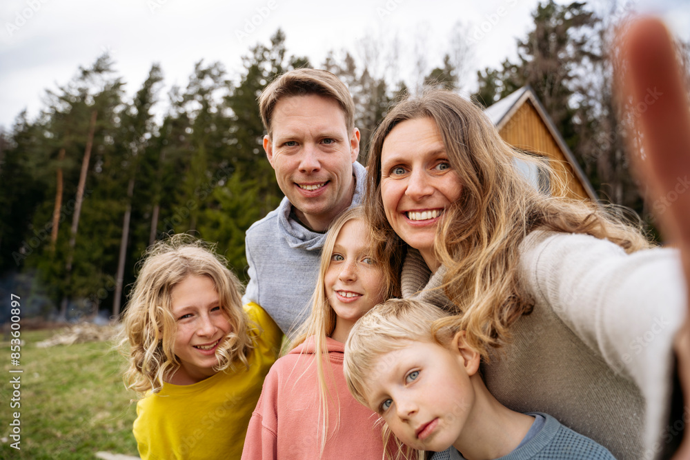 Happy family taking selfie together in back yard Happy family taking selfie together in back yard