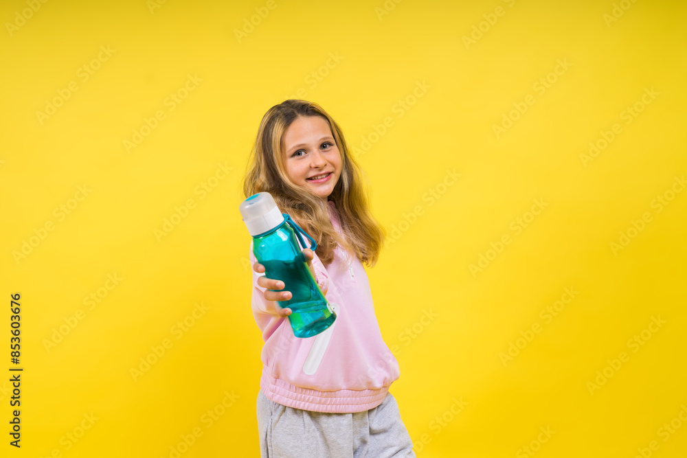 Girl teen hold water bottle. Health and water balance. Drink and beverage concept. Girl teen hold water bottle. Health and water balance. Drink and beverage concept.