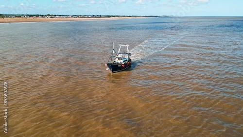 Fishing Boat, trawler, just offshore fishing, trawling with the coast, coastline visible photo