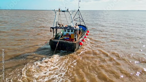 Fishing Boat, trawler, just offshore fishing, trawling with the coast, coastline visible photo