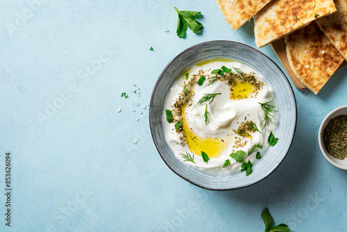 Tableau sur toile Labneh yogurt cream cheese dip with pita bread