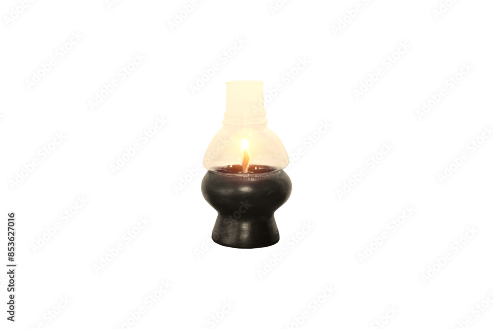 Close-up view of an oil lamp on a terracotta base with a glass cover with light from a fire lit in the center, isolated on a transparent background png file. Close-up view of an oil lamp on a terracotta base with a glass cover with light from a fire lit in the center, isolated on a transparent background png file.