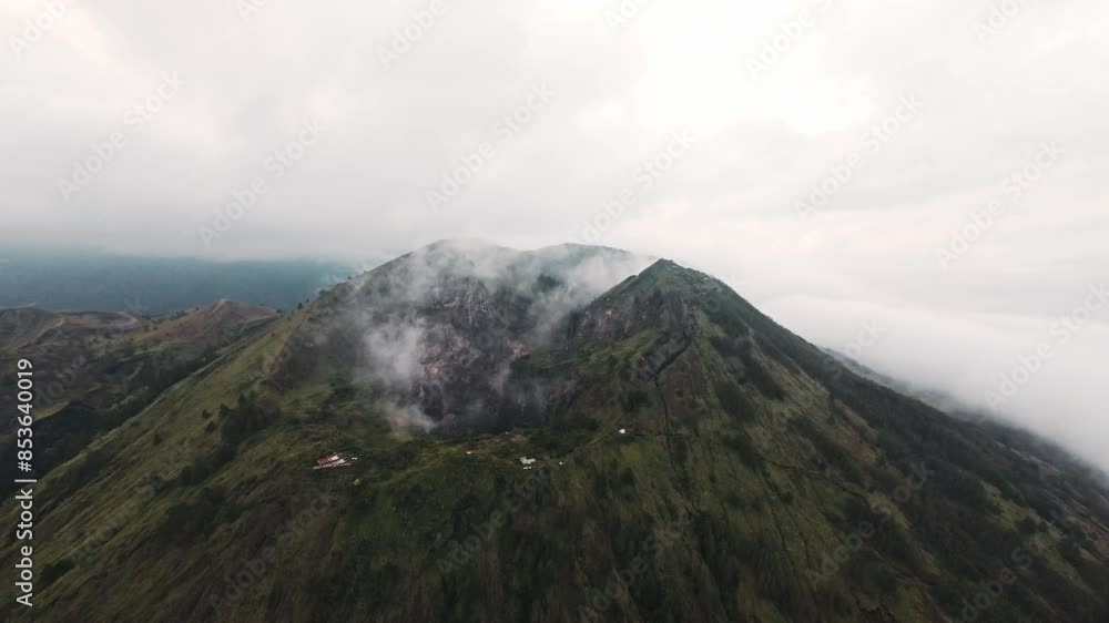 Smokes rising from active Batur volcano, aerial drone view Smokes rising from active Batur volcano, aerial drone view