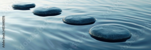 Zen Stones in Water, round stones floating on the water create a peaceful atmosphere that evokes relaxation or meditation. serene background with smooth.