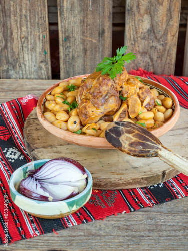 romanian traditional food, beans with boiled pork chop photo