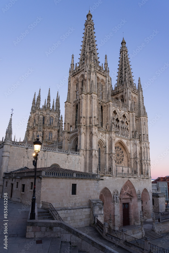 Gothic cathedral facade of the city of Burgos at dusk in a suuny day. Castilla y Leon, Spain. Gothic cathedral facade of the city of Burgos at dusk in a suuny day. Castilla y Leon, Spain.