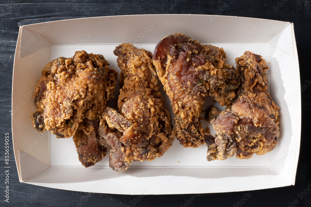 street food truck fried chicken wing drumlets in batter