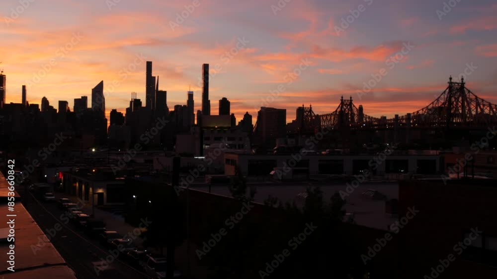 New York City Manhattan skyline cityscape. Rooftop in Queens, Midtown buildings, Queensboro Bridge. Sunset pink purple sky from roof in Long Island. Skyscrapers silhouette, high-rise architecture, NYC New York City Manhattan skyline cityscape. Rooftop in Queens, Midtown buildings, Queensboro Bridge. Sunset pink purple sky from roof in Long Island. Skyscrapers silhouette, high-rise architecture, NYC