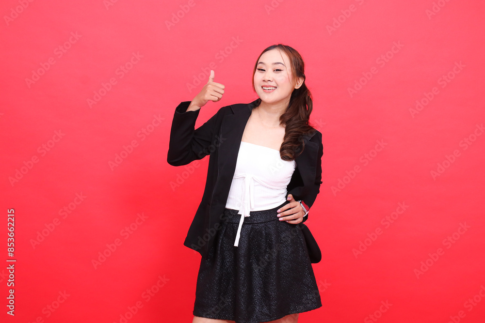 gesture of young asian office woman standing cheerful wearing black formal suit hands to hips and thumbs up okay sign, for corporate content, fashion, advertising, broadcast gesture of young asian office woman standing cheerful wearing black formal suit hands to hips and thumbs up okay sign, for corporate content, fashion, advertising, broadcast