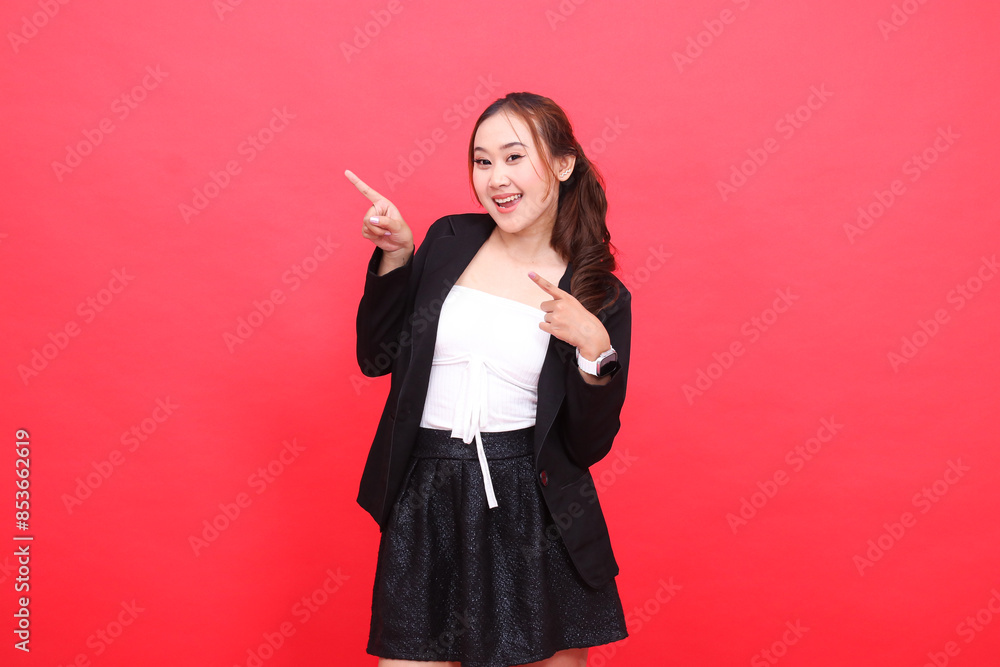 gesture of cheerful young indonesia office woman wearing black formal suit both hands pointing to the right, for corporate content, fashion, advertising, broadcast gesture of cheerful young indonesia office woman wearing black formal suit both hands pointing to the right, for corporate content, fashion, advertising, broadcast