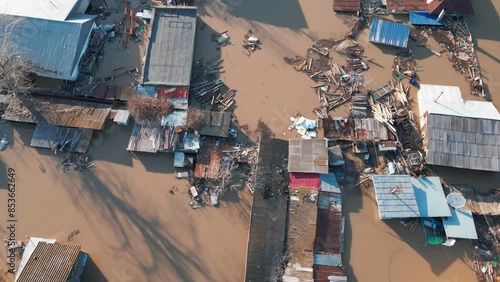 Damaged houses in the flood. Flood. The houses were washed away by the current of the water. A city destroyed by a flood. A natural disaster, an emergency. An environmental disaster. Damage, trouble.