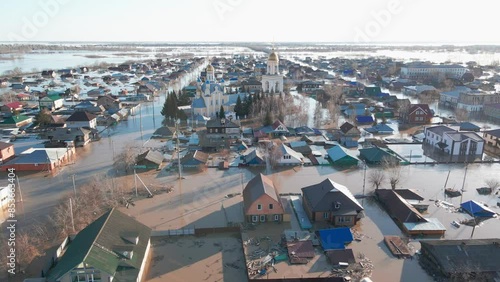 Damaged houses in the flood. Flood. The houses were washed away by the current of the water. A city destroyed by a flood. A natural disaster, an emergency. An environmental disaster. Damage, trouble.
