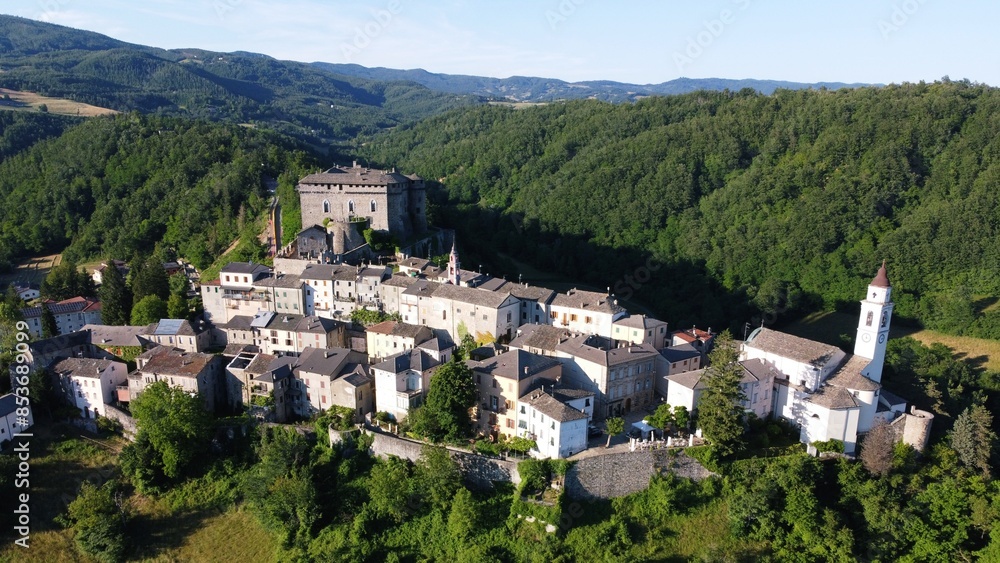 Naklejka premium Aerial view of the small village of Compiano and the castle of Compiano. Compiano, Parma, Italy