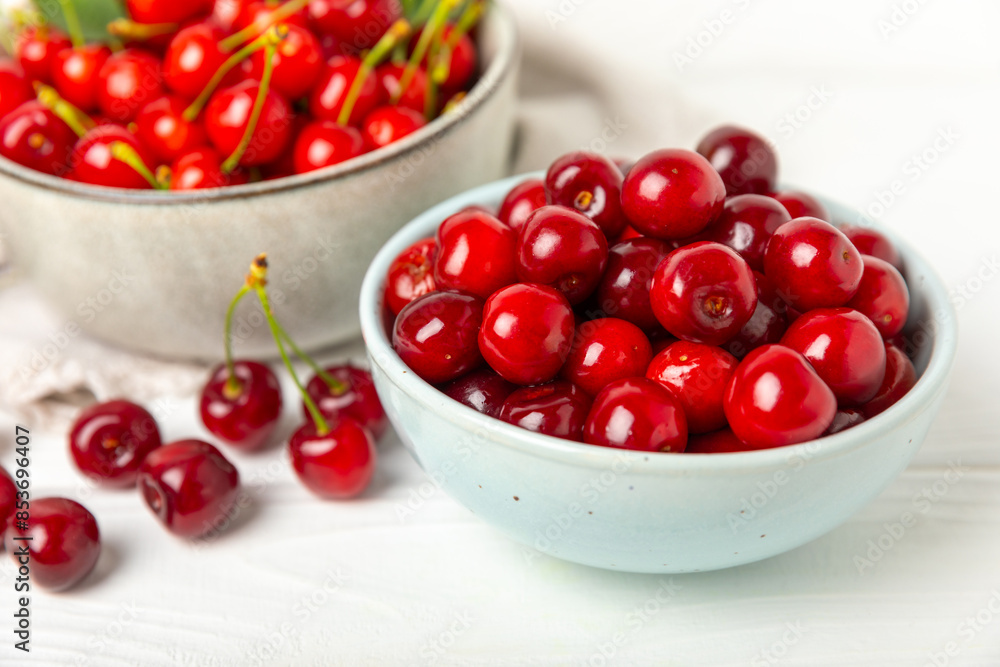 Cherries. Fresh ripe cherries with leaves on a textured wooden background. Fresh sweet organic cherry pile. Berries and fruits. Vegan. Healthy eating. Place for text. Copy space Cherries. Fresh ripe cherries with leaves on a textured wooden background. Fresh sweet organic cherry pile. Berries and fruits. Vegan. Healthy eating. Place for text. Copy space