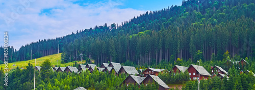 Panorama with tourist houses and conifer forests, Bukovel, Carpathians, Ukraine photo