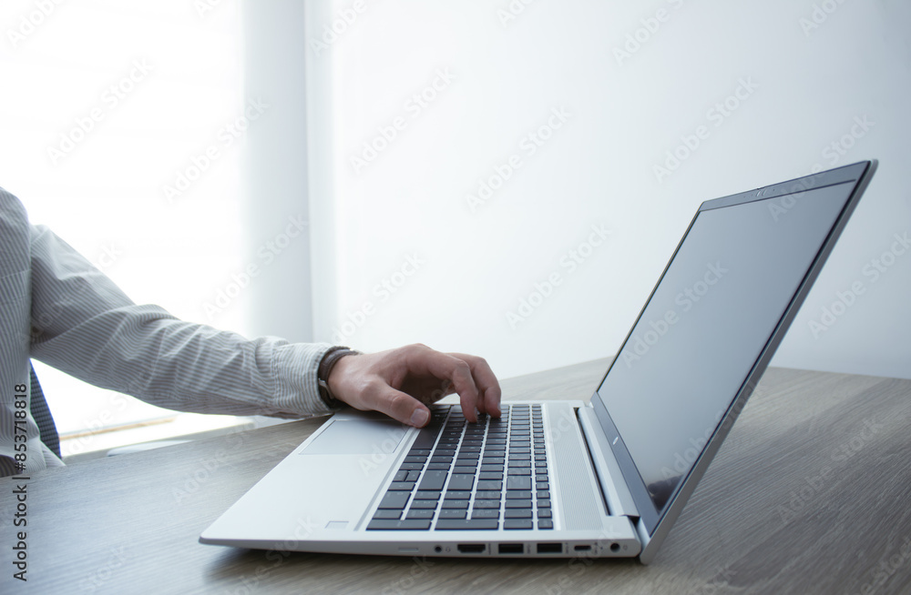 Business man hands typing on laptop computer keyboard, surfing the internet at the office with copy space for web banner, IT worker and business concept. Business man hands typing on laptop computer keyboard, surfing the internet at the office with copy space for web banner, IT worker and business concept.