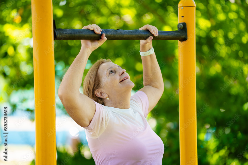 Obraz premium Elderly woman exercising. Fit senior lady running.