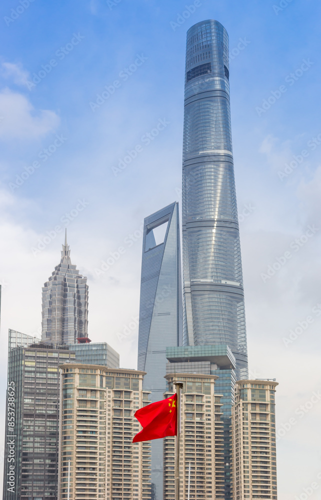Chinese national flag in front of scyscrapers in Shanghai, China