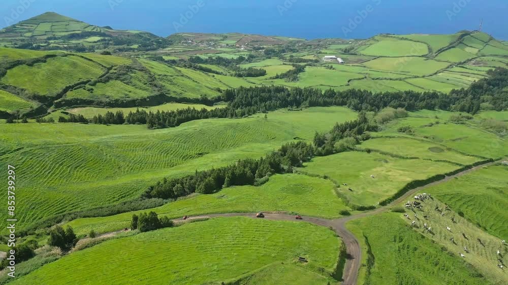 Lush green fields and rolling hills in sete cidades, azores on a sunny day, aerial view Lush green fields and rolling hills in sete cidades, azores on a sunny day, aerial view