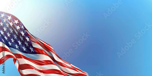 An American flag with red and white stripes waves proudly against a clear blue sky