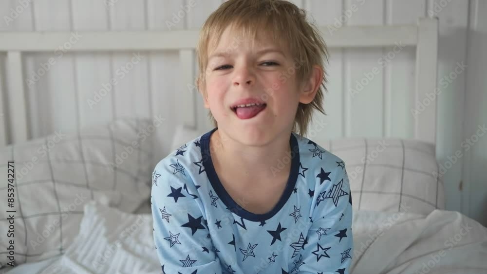 Boy joking, sticking tongue out with silly expression. Child making face. Funny foolishness portrait of little baby boy on white background. Adorable Caucasian kid making crazy and comical gesture. Boy joking, sticking tongue out with silly expression. Child making face. Funny foolishness portrait of little baby boy on white background. Adorable Caucasian kid making crazy and comical gesture.