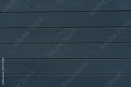 Wooden empty background of graphite color from boards photo