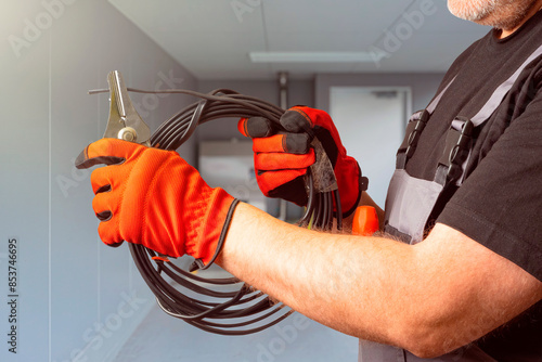 Wire in hands electrician. ...
