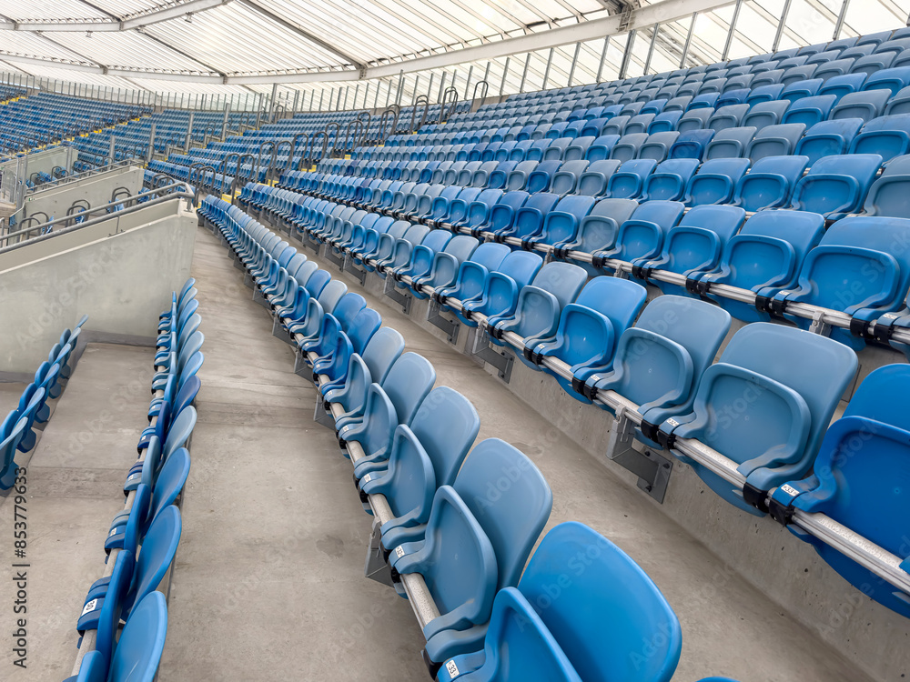 Obraz premium empty blue tribunes? seating rows in a stadium
