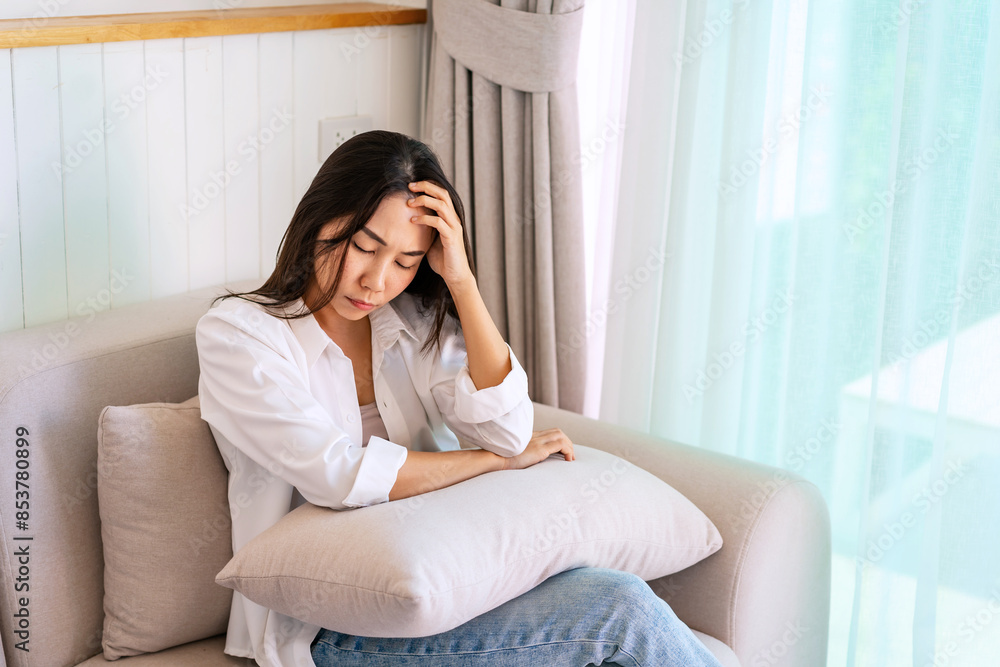 Lonely young Asian woman feeling depressed and stressed in living room at home, Negative emotion and mental health concept Lonely young Asian woman feeling depressed and stressed in living room at home, Negative emotion and mental health concept