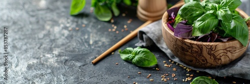 Panel kuchenny z motywem Dark Stone Background with Basil Bunch in Wooden Bowl, Natural Blurred Frame with Gray Napkin