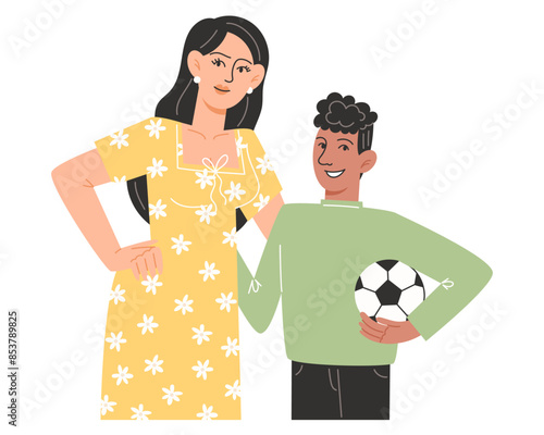 Young mother hugs her son holding a soccer ball