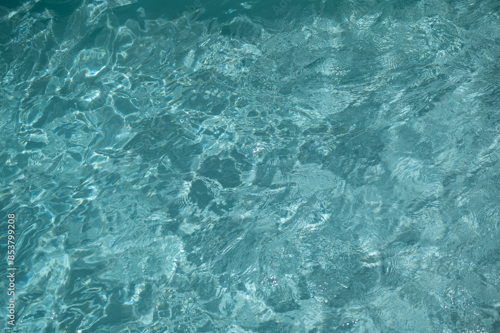 Shining turquoise water ripple background. Summer concept Shining turquoise water ripple background. Summer concept