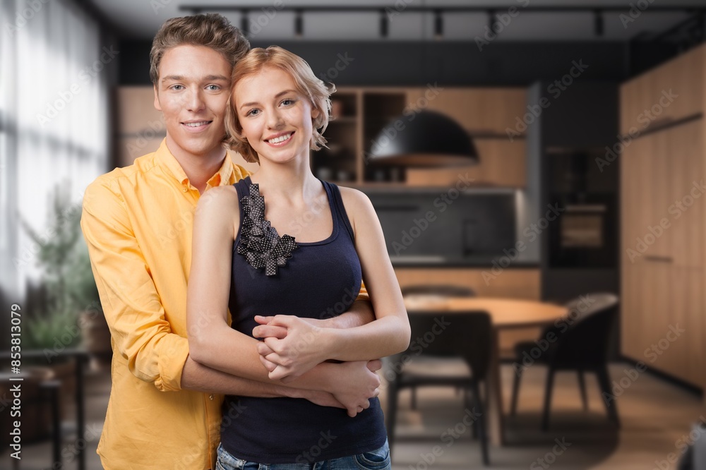 Naklejka premium Happy smiling romantic couple hugging at home