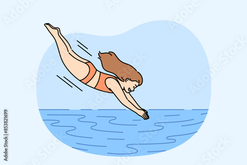 Little girl dives into pool to swim in water or enjoy swim in sea to cool off from hot sun. Woman in swimsuit relaxes at resort and enjoys jumping in pool and doing sports or diving
