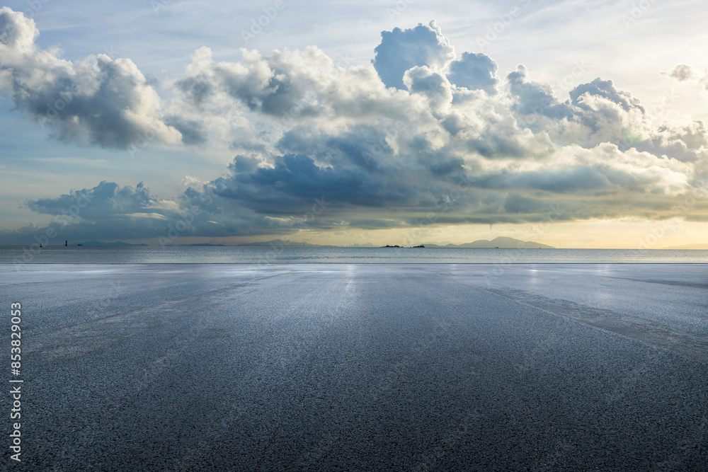 Asphalt road square and sea with sky clouds natural background Asphalt road square and sea with sky clouds natural background
