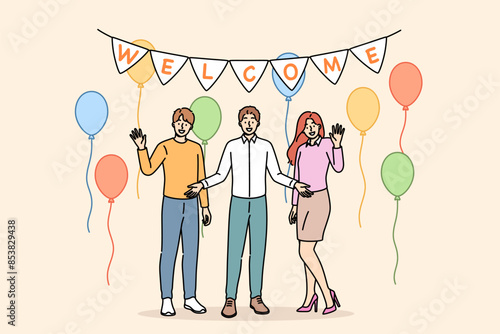 Welcome party from happy family welcoming friends into new apartment with balloons to celebrate move. Welcome party for employee who got job at company and became member of business team