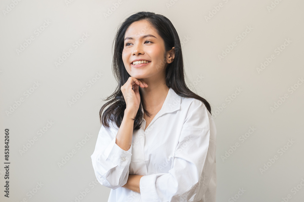 Smile positive, happy asian young woman wearing casual shirt, portrait of pretty female with black long hair feeling prond, standing expression gesture face relax looking at camera on white background Smile positive, happy asian young woman wearing casual shirt, portrait of pretty female with black long hair feeling prond, standing expression gesture face relax looking at camera on white background