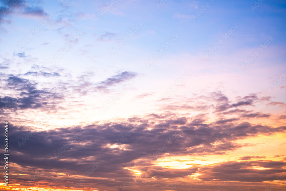 Obraz premium Beautiful , luxury soft gradient orange gold clouds and sunlight on the blue sky perfect for the background, take in everning,Twilight, Large size, high definition landscape photo