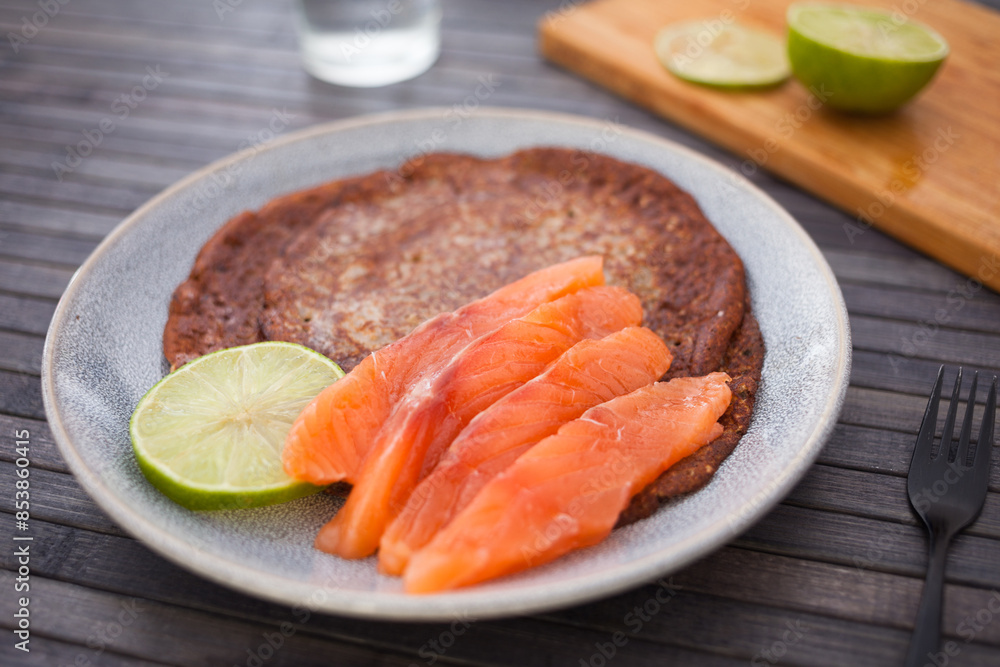 Salted salmon fillet with buckwheat pancakes and lime Salted salmon fillet with buckwheat pancakes and lime