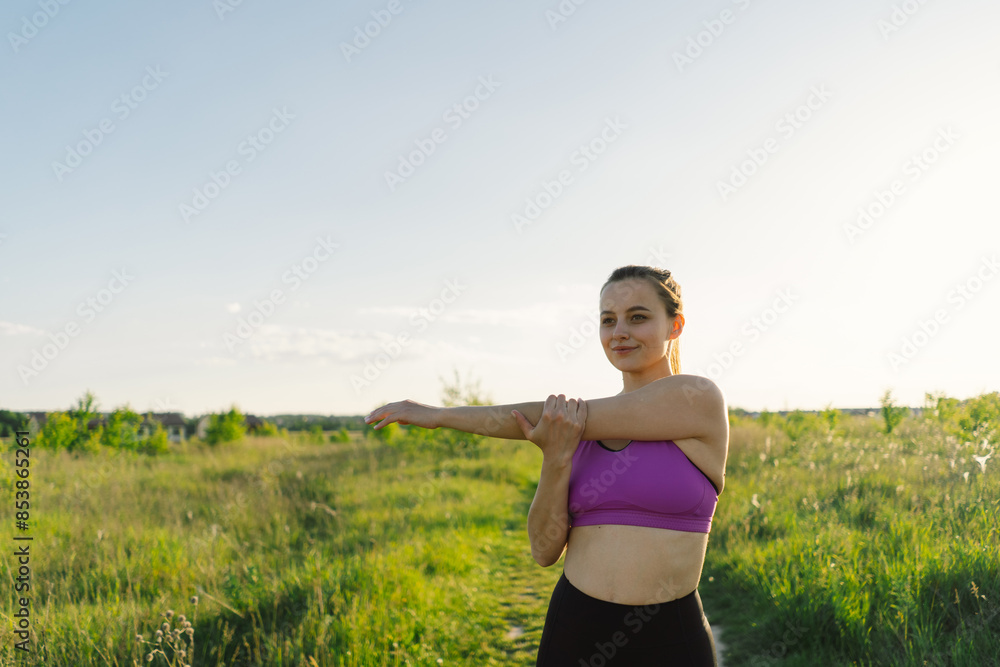 Beautiful girl doing fitness or yoga in nature on a sunny summer sunset. Body positive, sports for women, harmony, healthy lifestyle, self-love and wellness. Beautiful girl doing fitness or yoga in nature on a sunny summer sunset. Body positive, sports for women, harmony, healthy lifestyle, self-love and wellness.