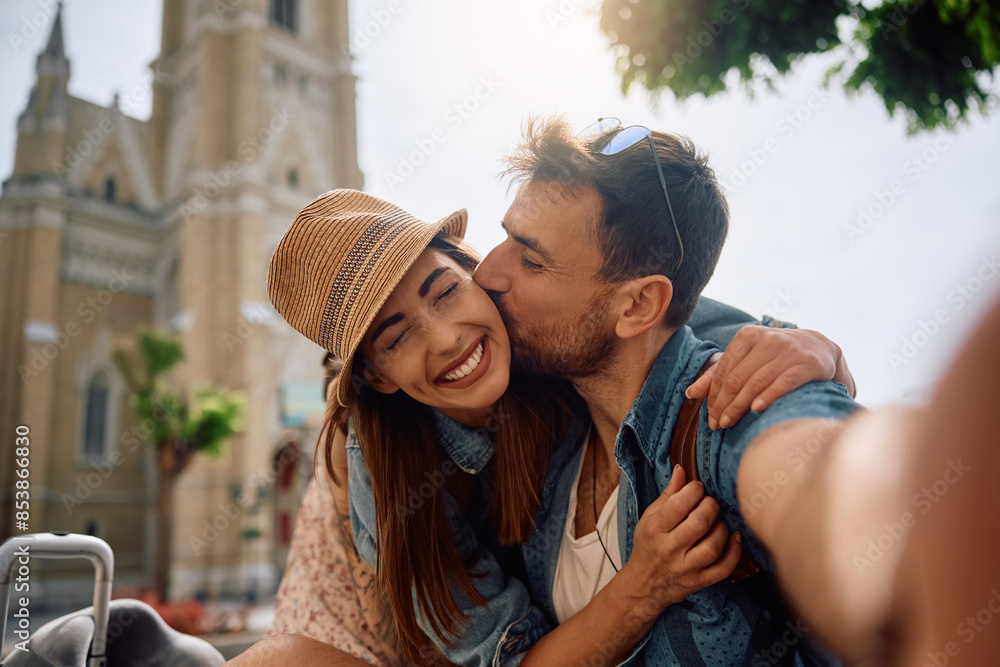 Carefree couple of tourists taking selfie while traveling together. Carefree couple of tourists taking selfie while traveling together.