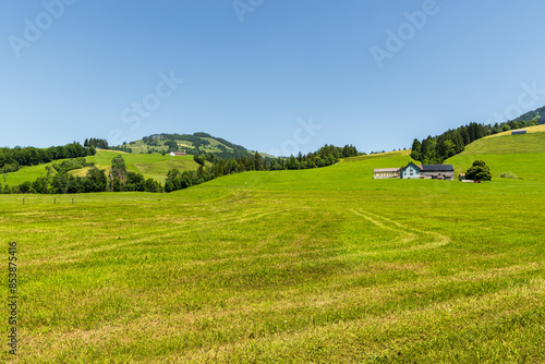 Appenzellerland, hilly landscape with secluded farms and green meadows, Bruelisau, Canton of Appenzell Innerrhoden, Switzerland photo
