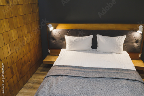 Fotografie A bed with white pillows and a made-up bed in a hotel. Clean bed.